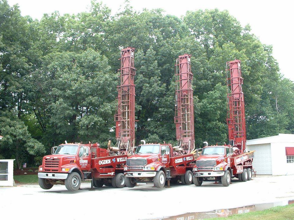 Heavy commercial rotary drill rigs installed on an institutional New England geothermal borefield