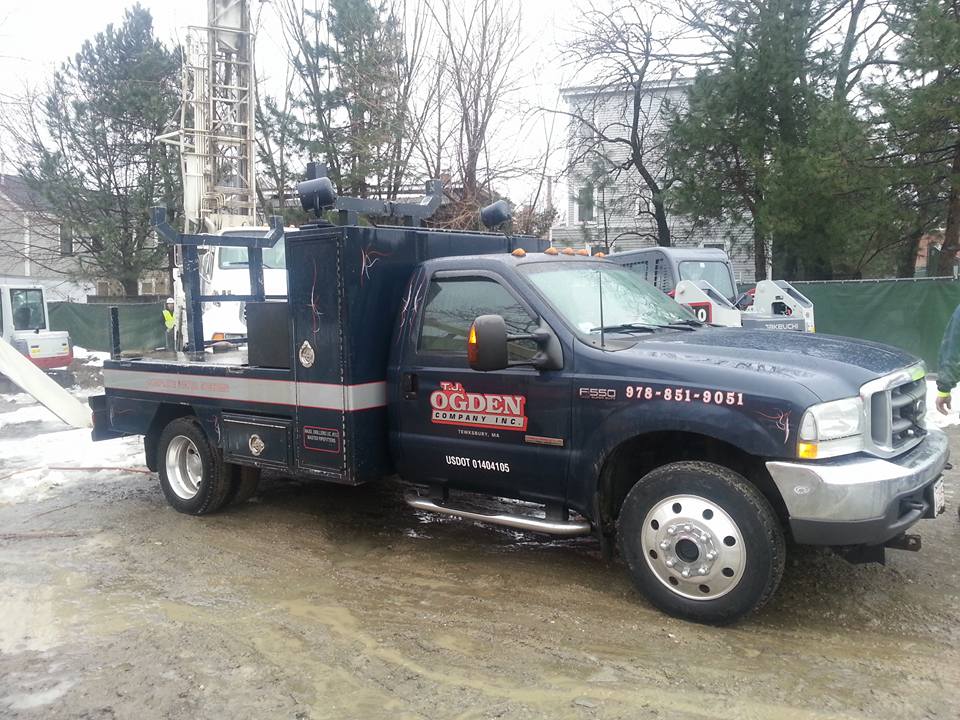 Ogden Wells heavy duty boom and crane service truck on location